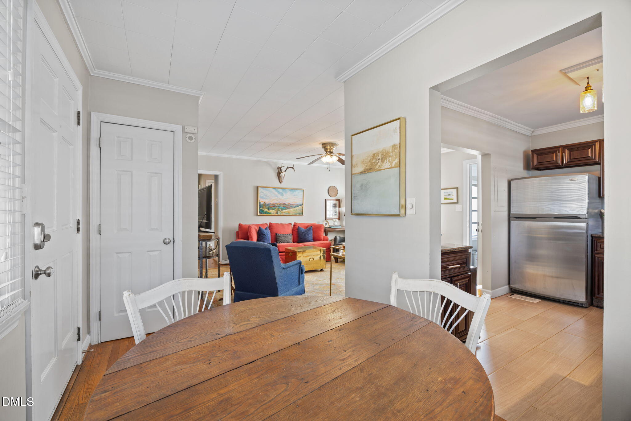 728 East Whitaker Mill Road Raleigh, NC 27608 - Photo 7 of 39 a bedroom with a bed and a refrigerator