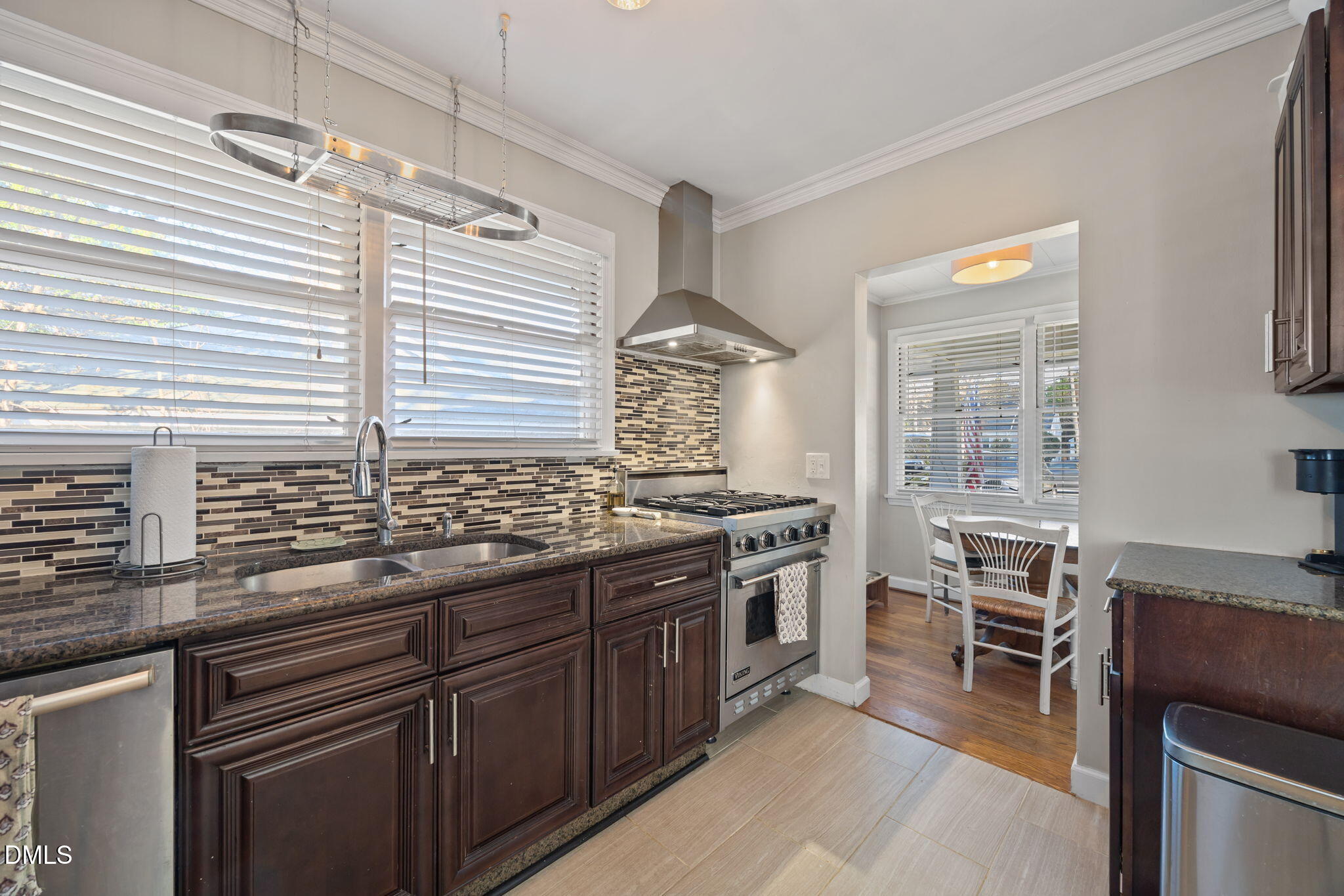 728 East Whitaker Mill Road Raleigh, NC 27608 - Photo 8 of 39 a kitchen with stainless steel appliances granite countertop a stove and a sink