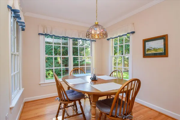 a kitchen with stainless steel appliances a stove microwave and refrigerator