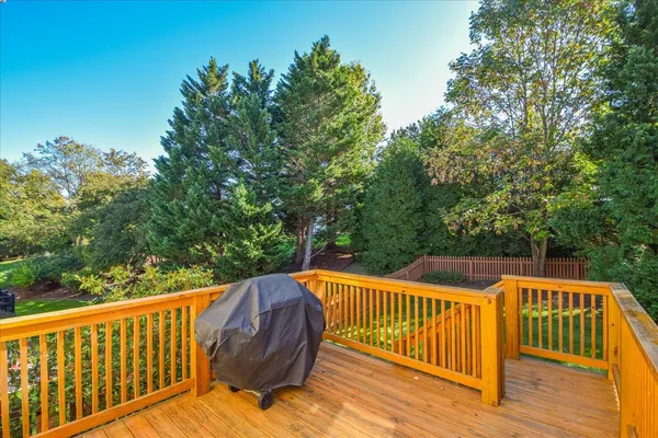 a view of a deck with a yard