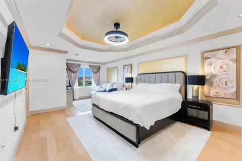 a spacious bedroom with a bed and a large window