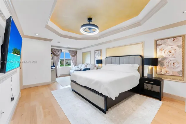 a spacious bedroom with a bed and a large window