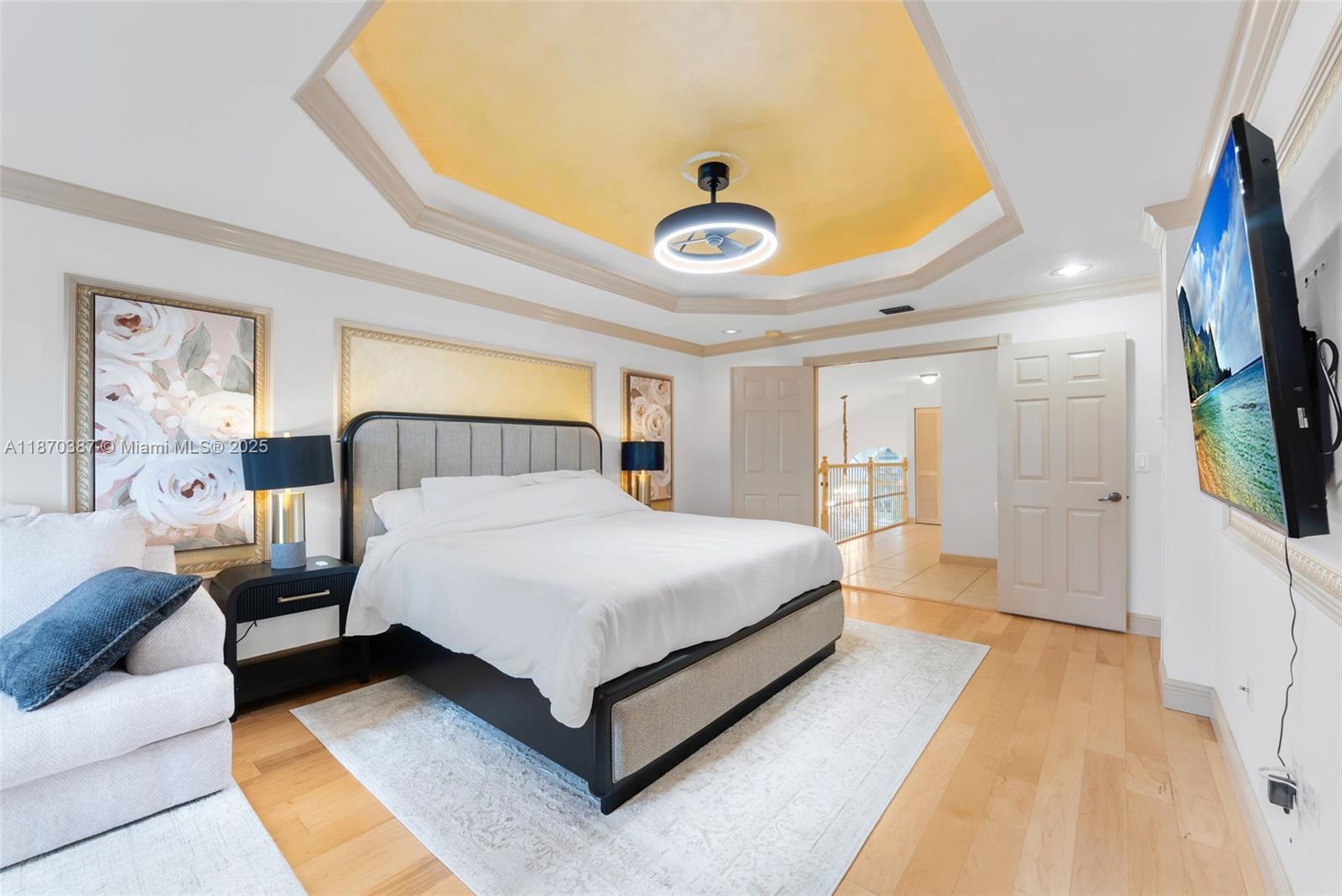 17431 Southwest 35th Street Miramar, FL 33029 - Photo 14 of 32 a spacious bedroom with a bed and a flat tv screen