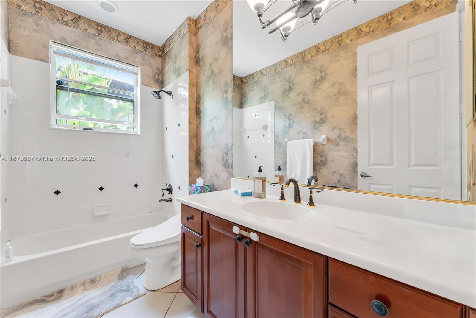 17431 Southwest 35th Street Miramar, FL 33029 - Photo 19 of 32 a bathroom with a sink a toilet and a bathtub
