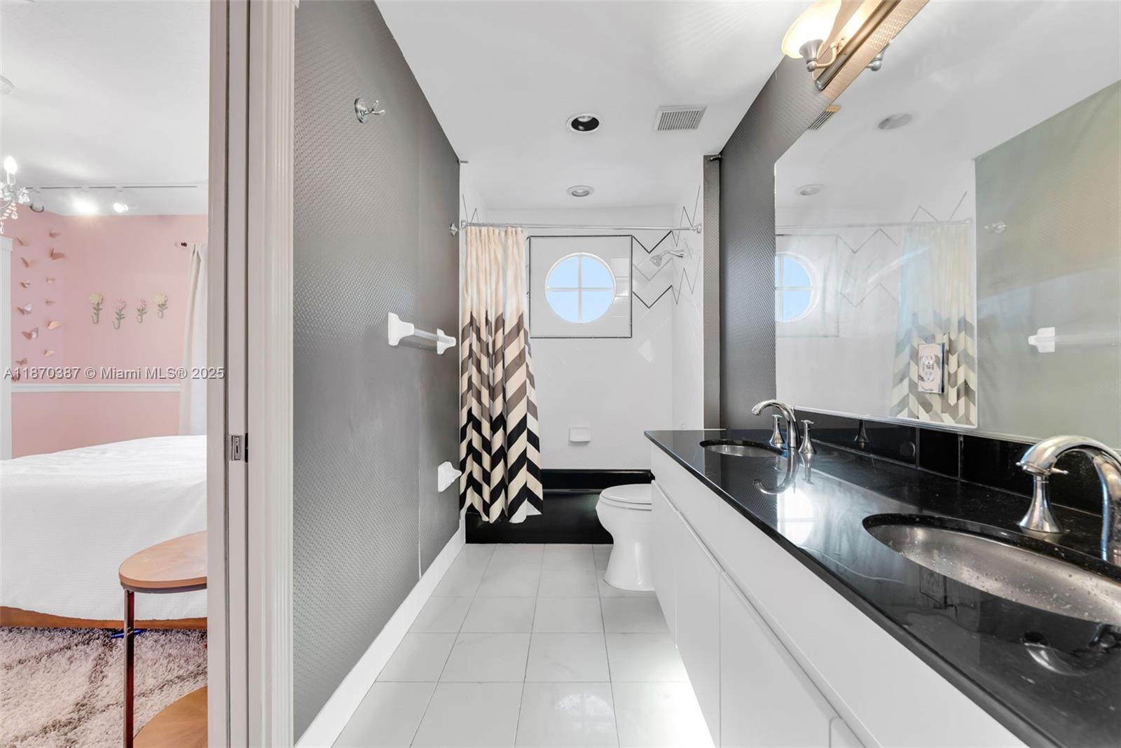 17431 Southwest 35th Street Miramar, FL 33029 - Photo 22 of 32 a spacious bathroom with a double vanity sink and a mirror