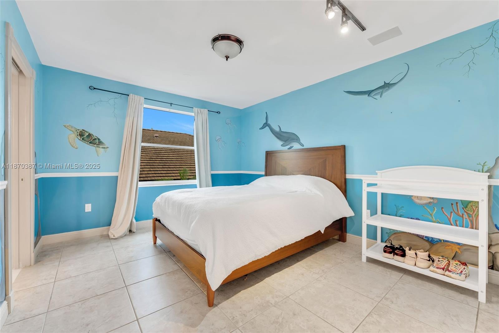 17431 Southwest 35th Street Miramar, FL 33029 - Photo 23 of 32 a bedroom with a bed and a window