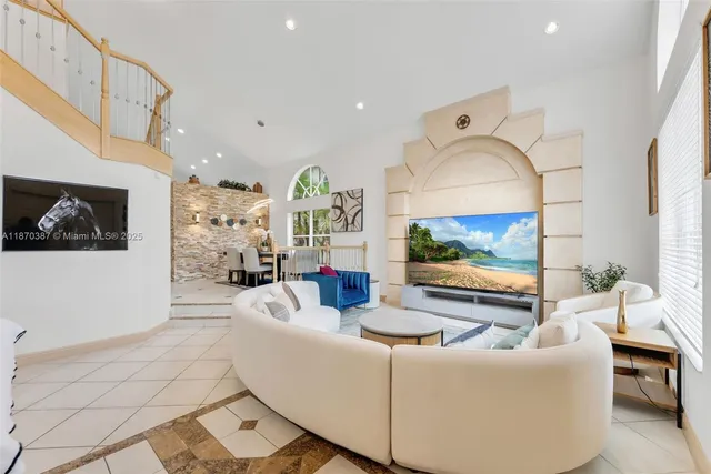 a living room with furniture and a flat screen tv