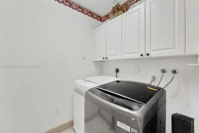 a kitchen with a sink a stove and cabinets
