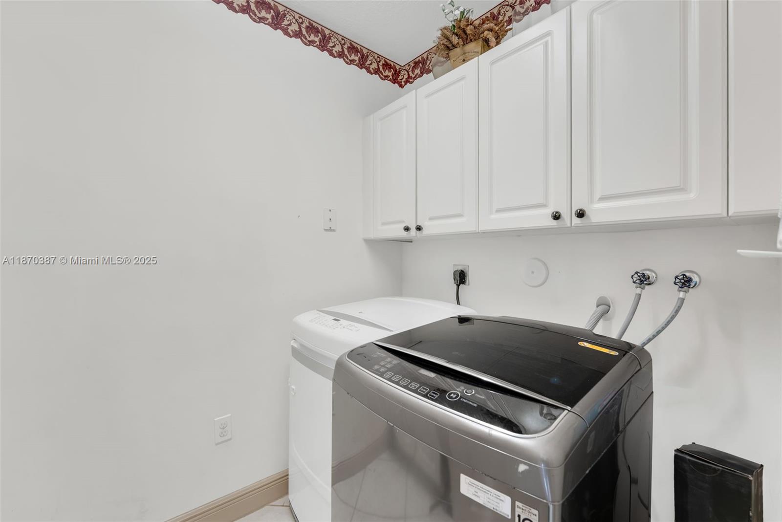 17431 Southwest 35th Street Miramar, FL 33029 - Photo 27 of 32 a kitchen with a sink a stove and cabinets