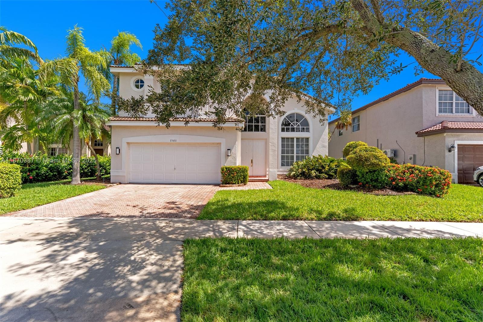 17431 Southwest 35th Street Miramar, FL 33029 - Photo 28 of 32 a front view of house with yard and green space