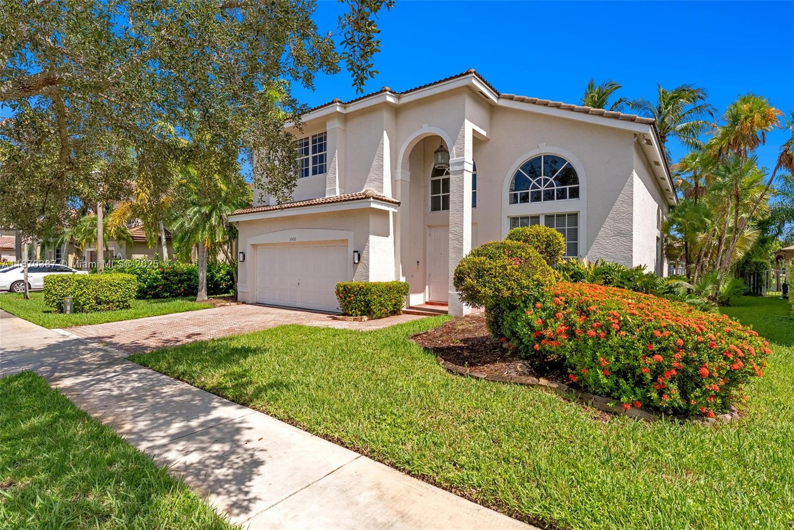 17431 Southwest 35th Street Miramar, FL 33029 - Photo 29 of 32 a front view of a house with garden