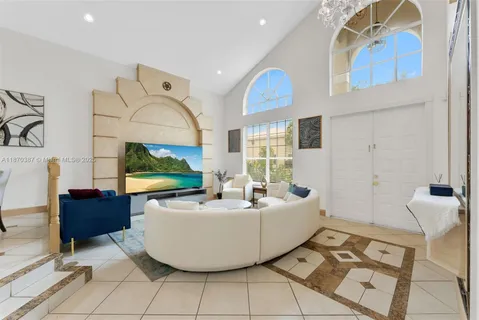 a living room with a table and a fireplace