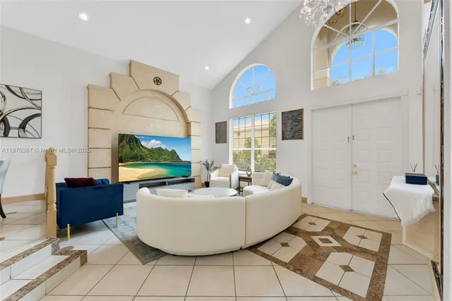 a living room with a table and a fireplace