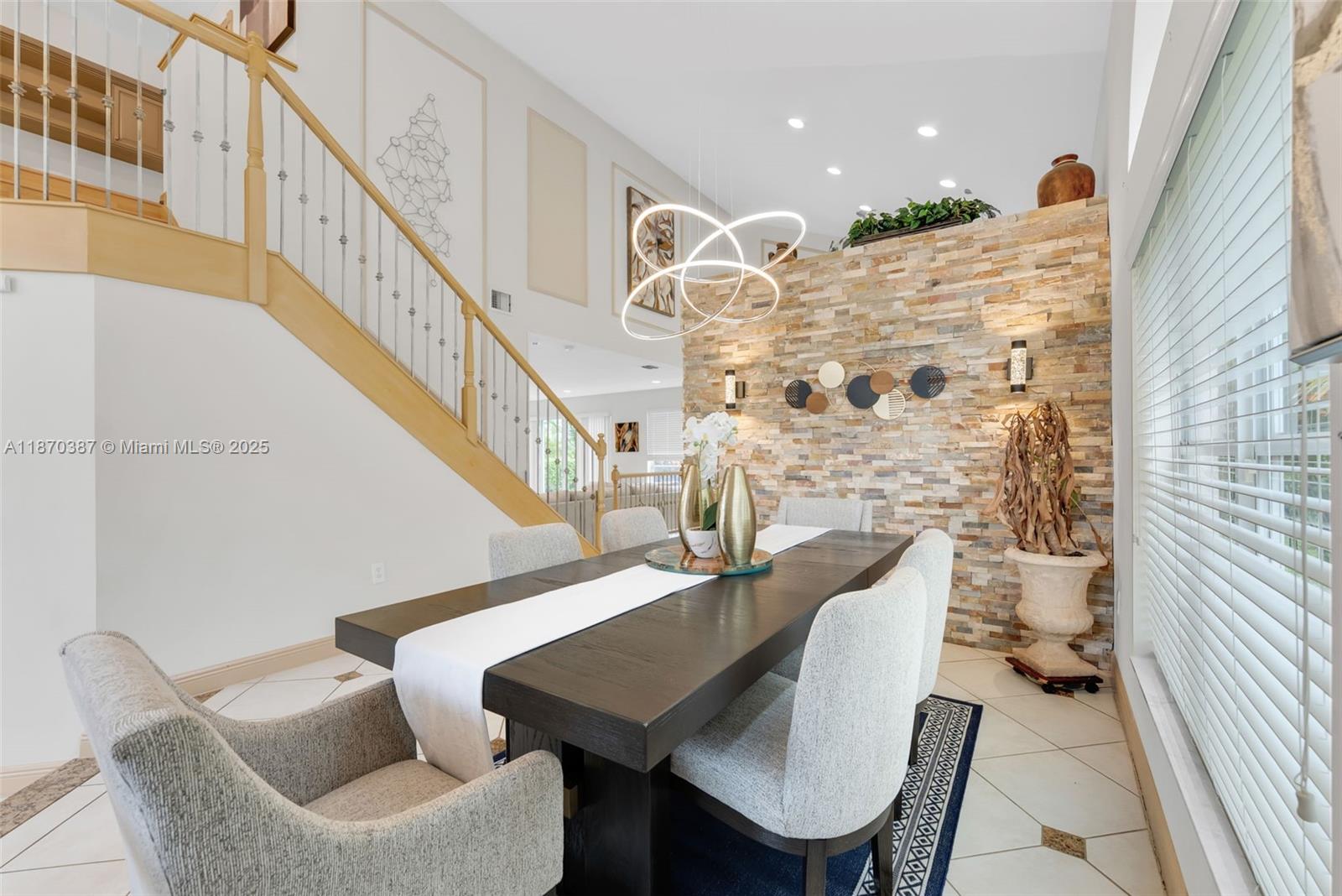 17431 Southwest 35th Street Miramar, FL 33029 - Photo 9 of 32 a view of a dining room with furniture and a chandelier