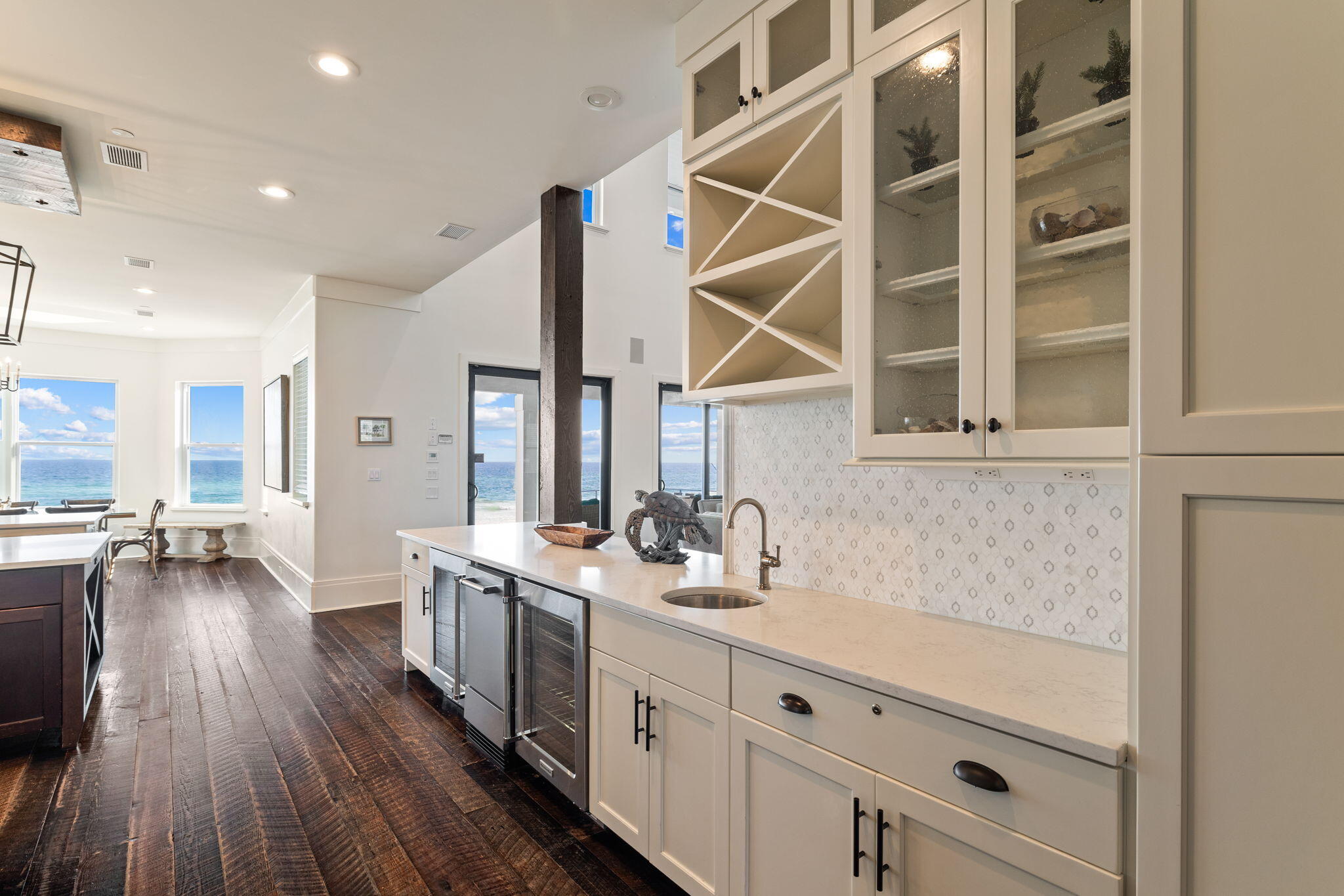 138 West Beach Drive Miramar Beach, FL 32550 - Photo 13 of 72 a kitchen with a sink wooden floor and cabinets