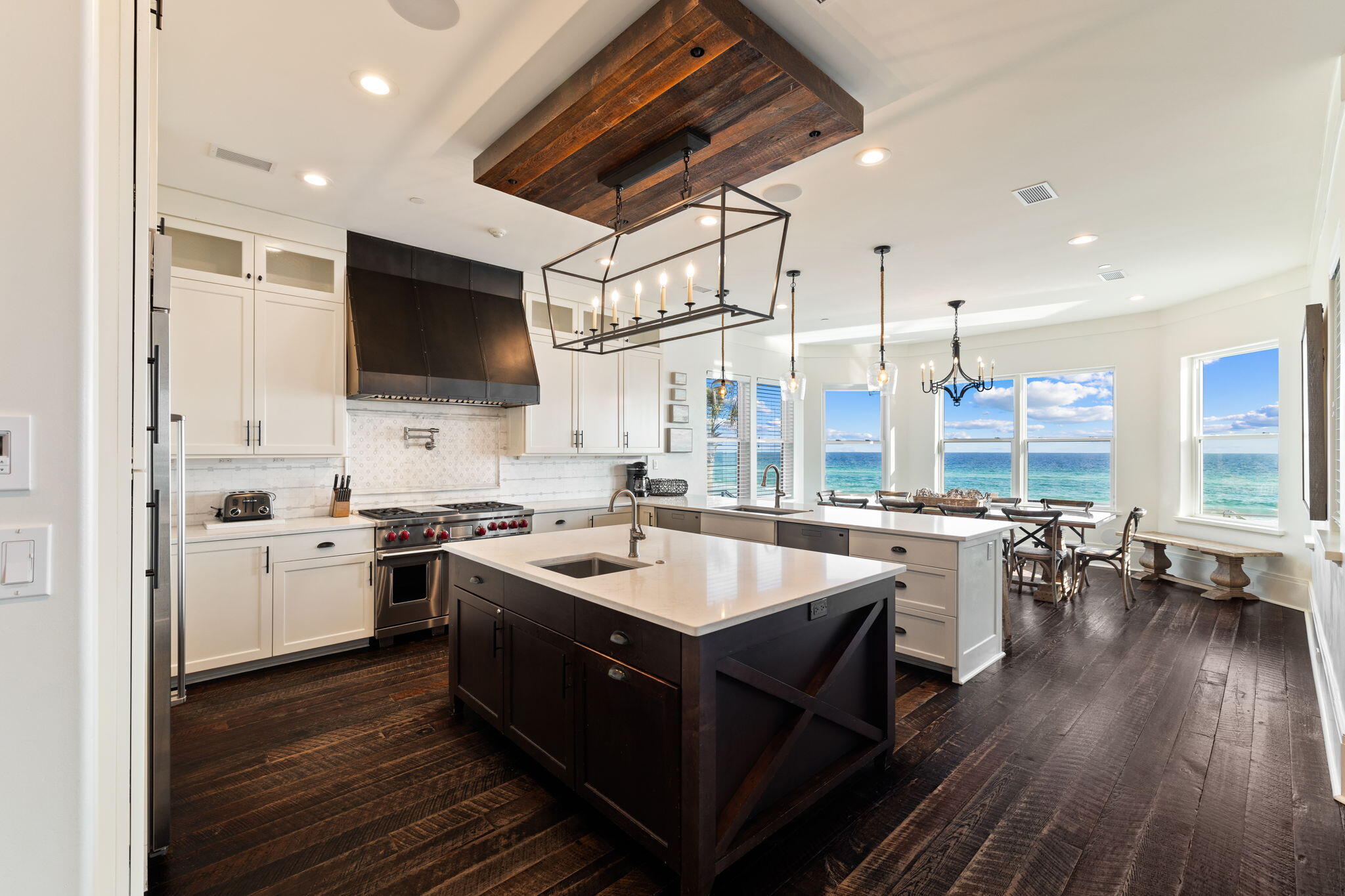 138 West Beach Drive Miramar Beach, FL 32550 - Photo 19 of 72 a kitchen with a sink stove and wooden floor
