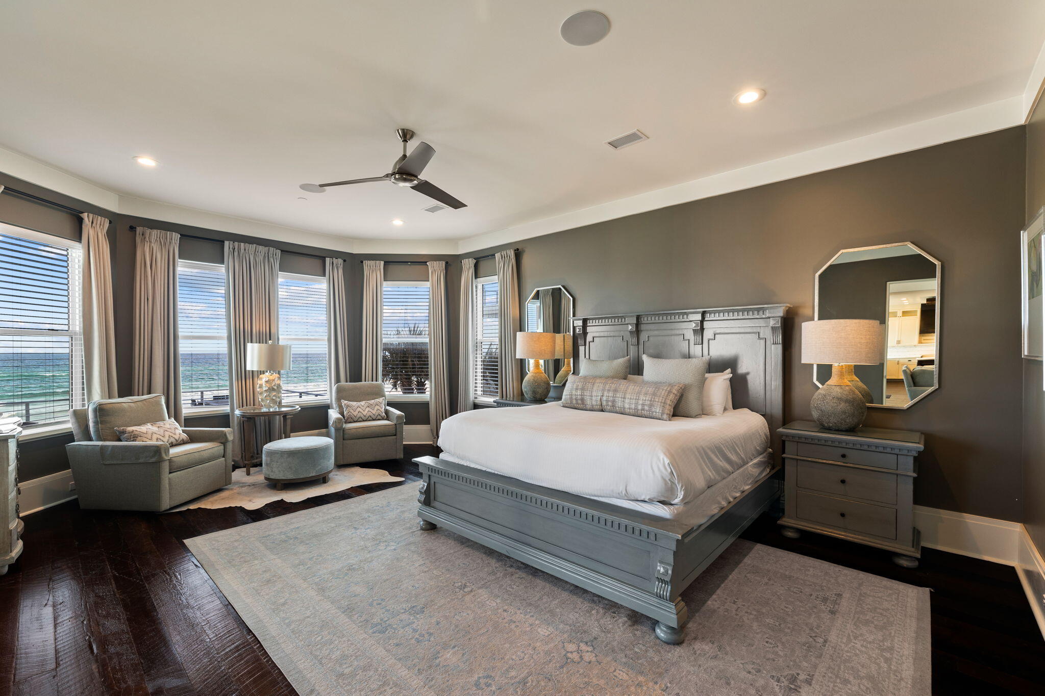 138 West Beach Drive Miramar Beach, FL 32550 - Photo 23 of 72 a spacious bedroom with a bed a couch and large window