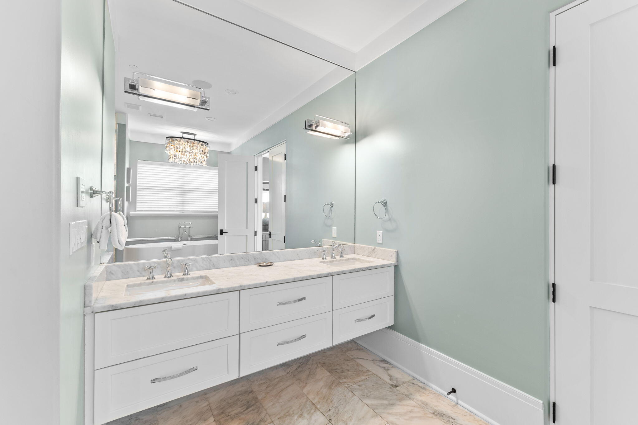 138 West Beach Drive Miramar Beach, FL 32550 - Photo 26 of 72 a bathroom with a double vanity sink and mirror with shower