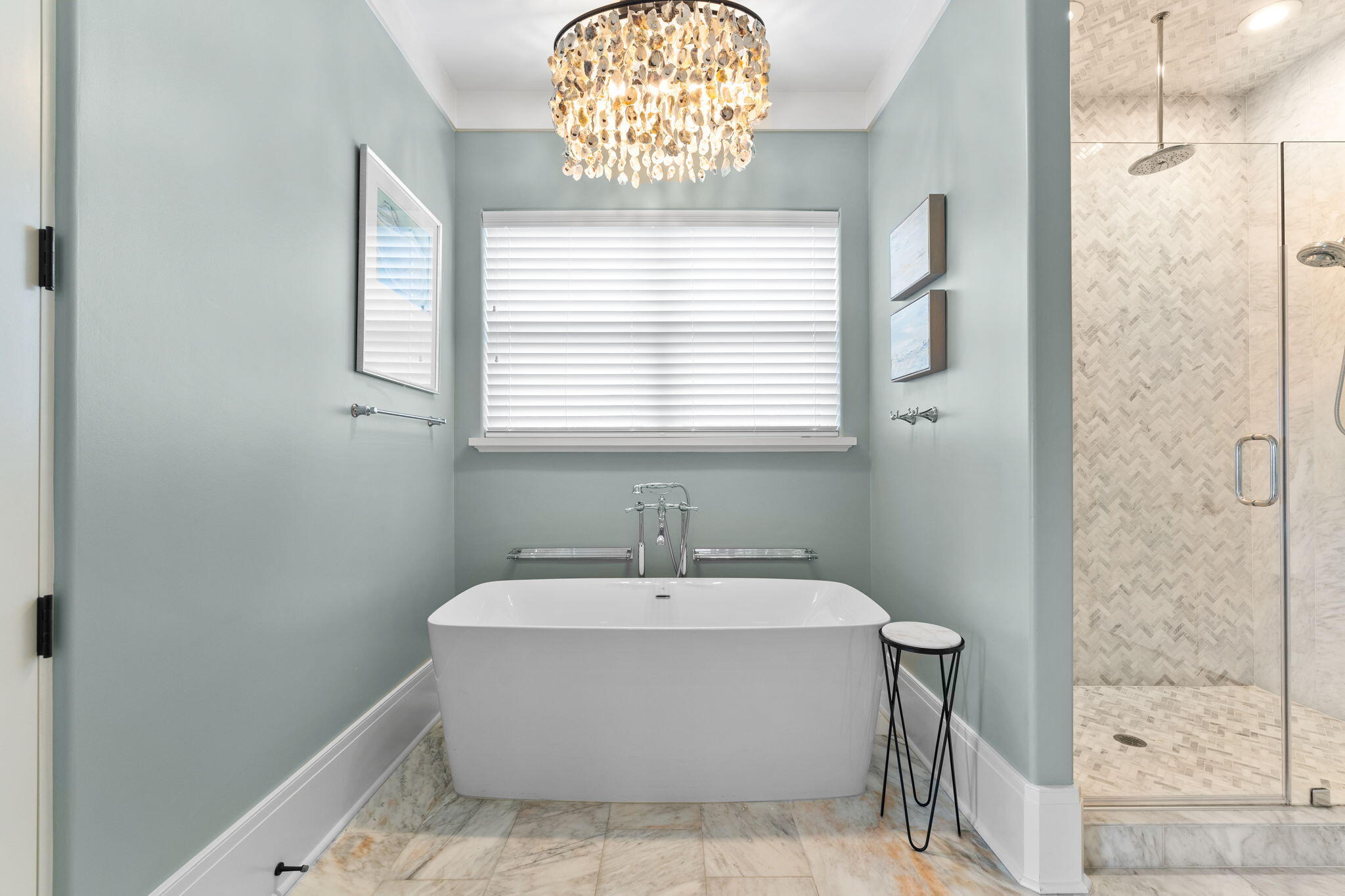 138 West Beach Drive Miramar Beach, FL 32550 - Photo 27 of 72 a white bath tub sitting in a bathroom next to a window