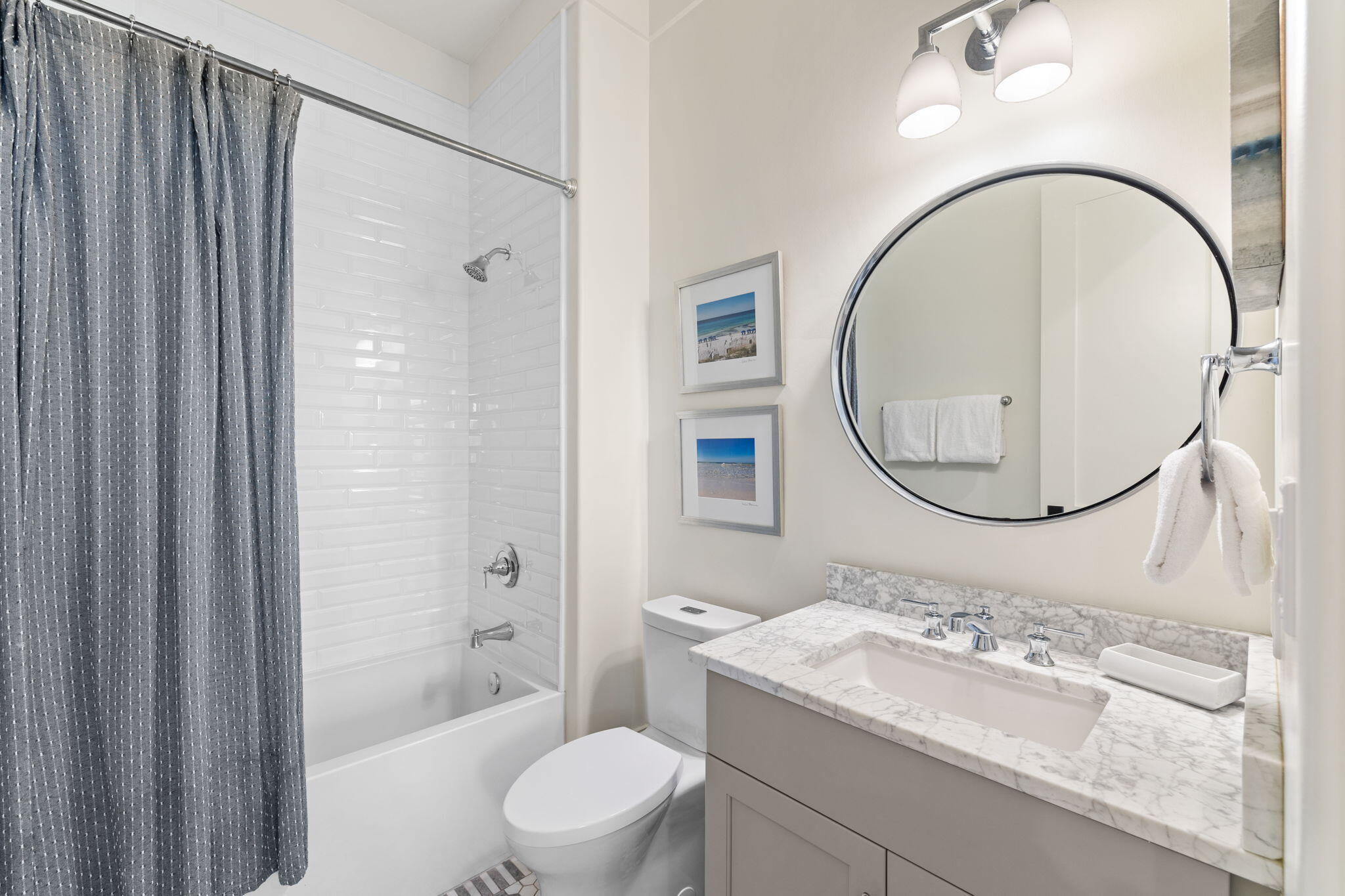 138 West Beach Drive Miramar Beach, FL 32550 - Photo 31 of 72 a bathroom with a sink a toilet and a mirror