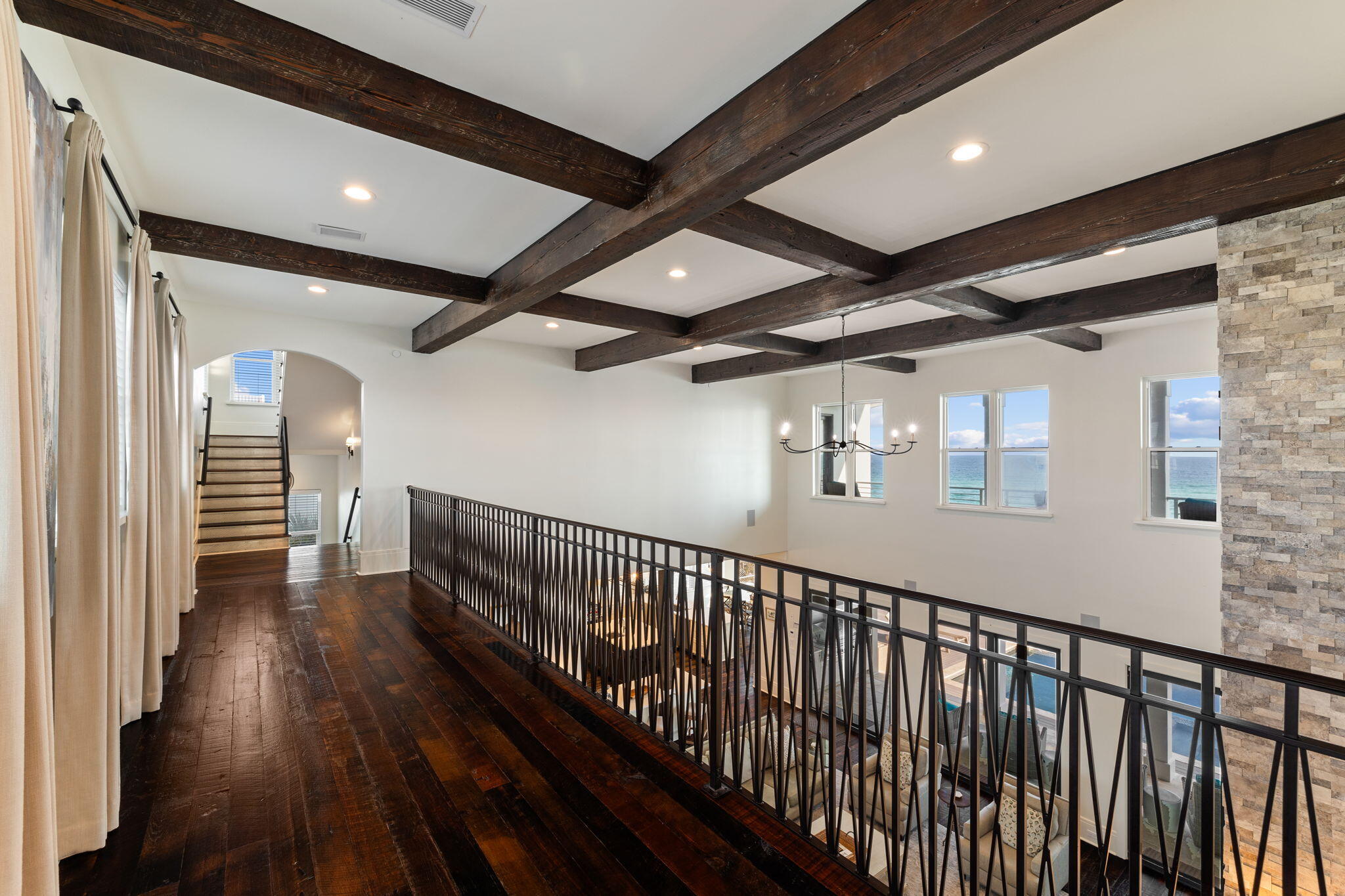 138 West Beach Drive Miramar Beach, FL 32550 - Photo 33 of 72 a view of a hallway with wooden floor