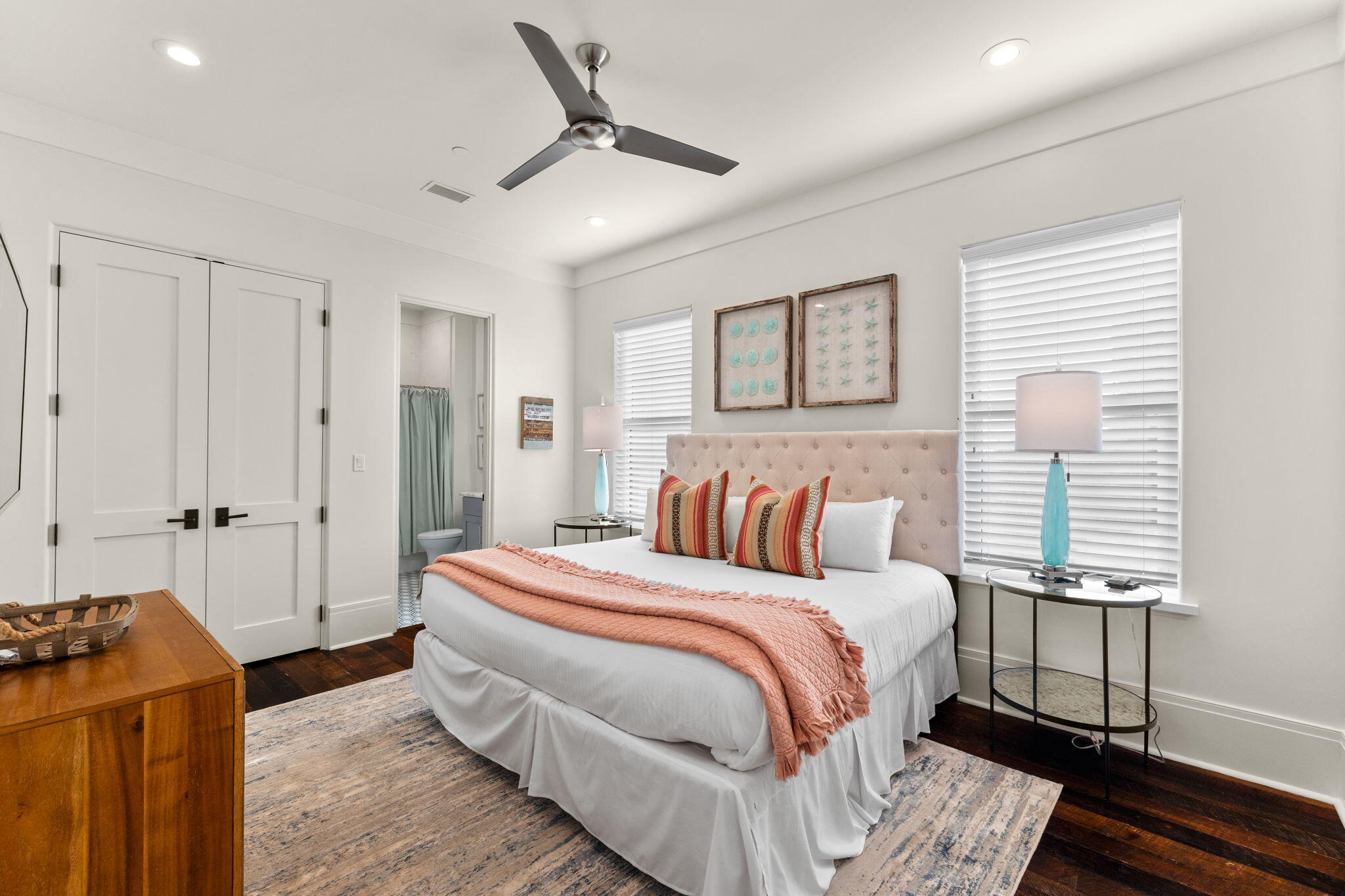 138 West Beach Drive Miramar Beach, FL 32550 - Photo 39 of 72 a bedroom with a bed and wooden floor