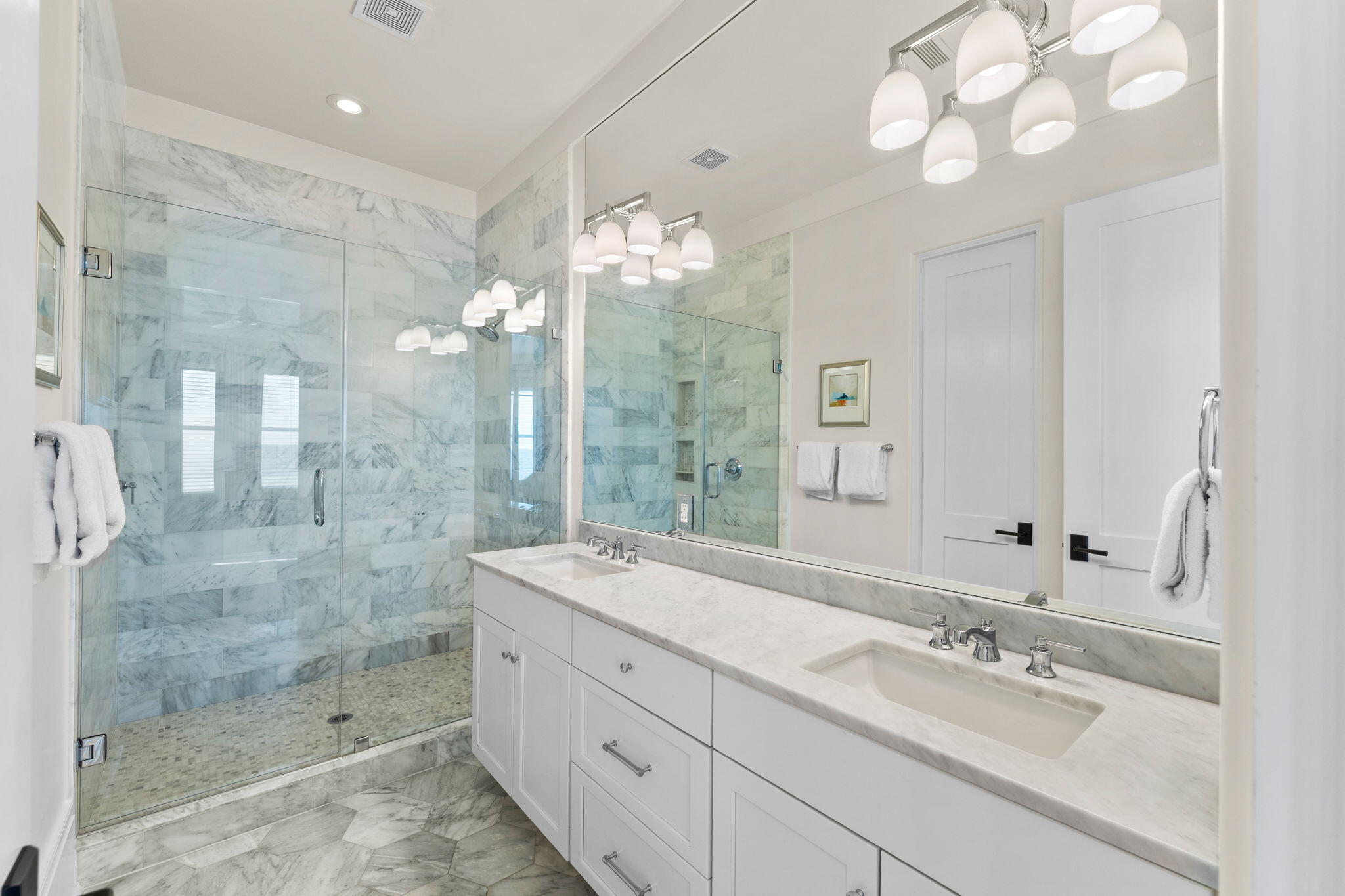 138 West Beach Drive Miramar Beach, FL 32550 - Photo 44 of 72 a bathroom with a sink mirror and shower