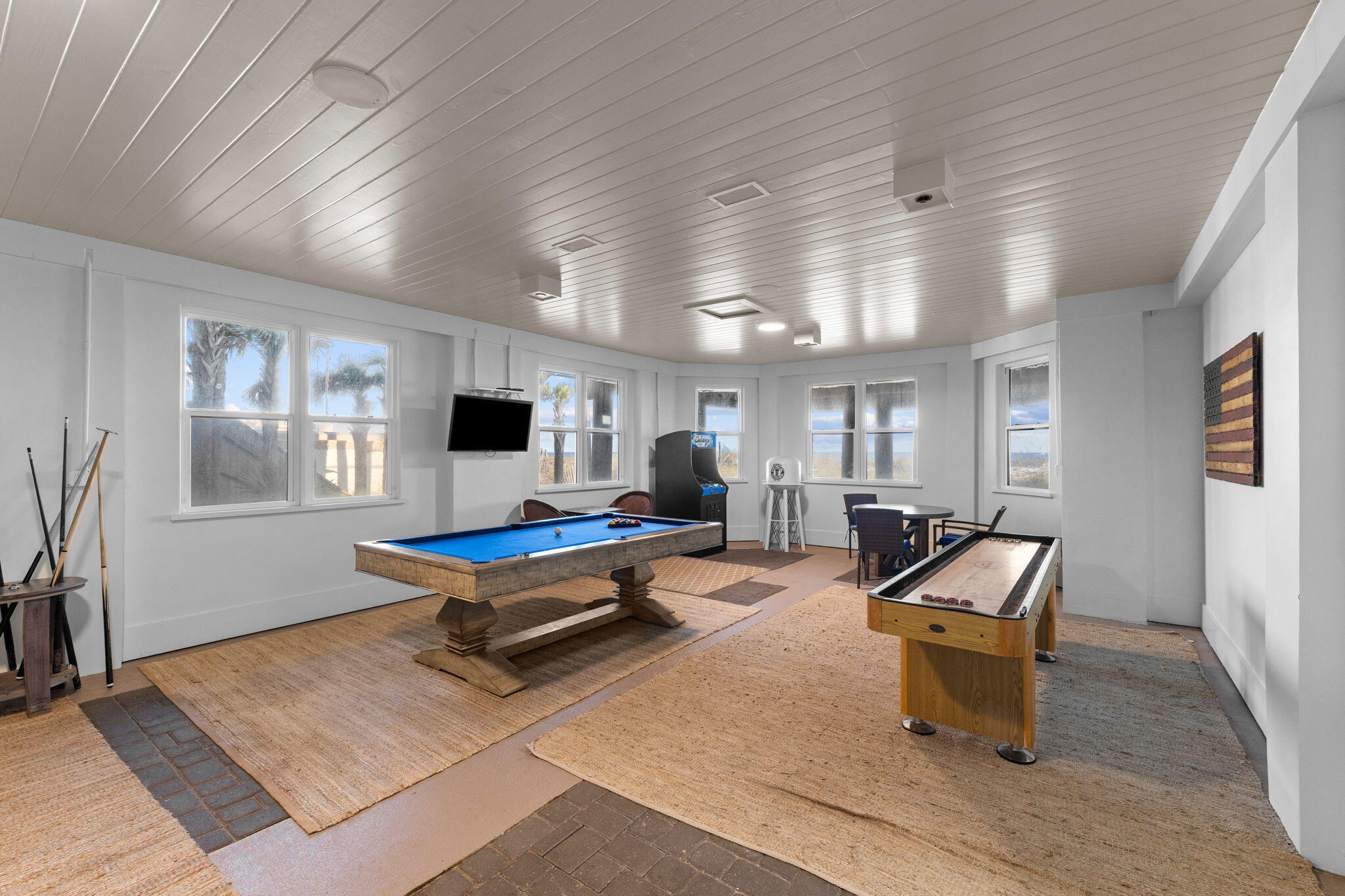 138 West Beach Drive Miramar Beach, FL 32550 - Photo 50 of 72 a living room with furniture pool table and a flat screen tv