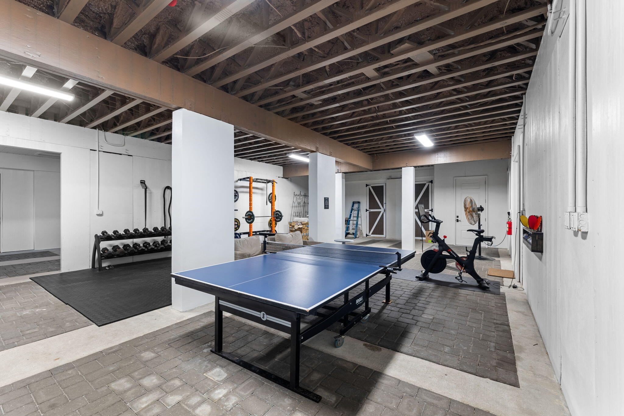 138 West Beach Drive Miramar Beach, FL 32550 - Photo 53 of 72 a living room with furniture a table and a potted plant