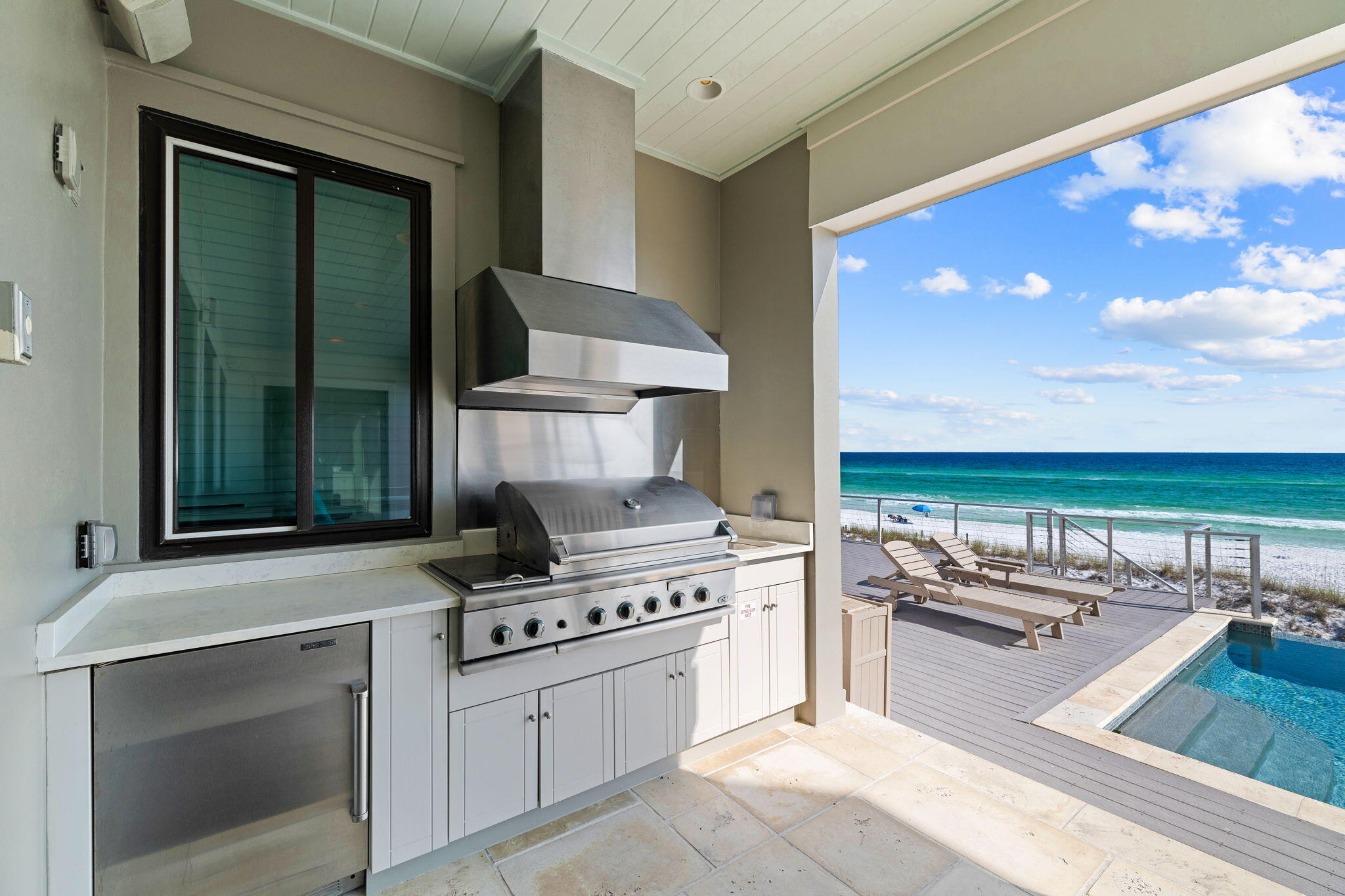 138 West Beach Drive Miramar Beach, FL 32550 - Photo 70 of 72 a kitchen with a stove and a view of living room