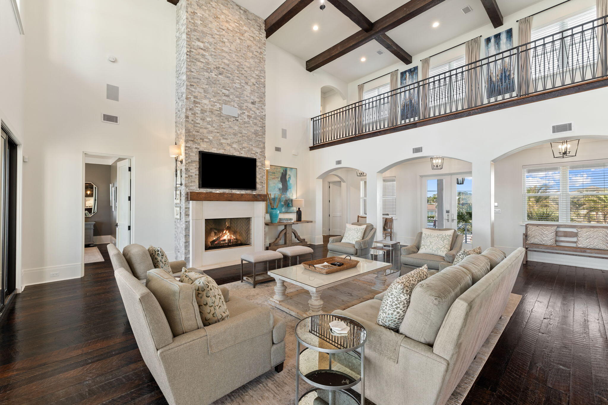 138 West Beach Drive Miramar Beach, FL 32550 - Photo 10 of 72 a living room with furniture a fireplace and a flat screen tv