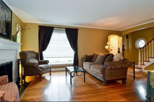 9 West Touhy Avenue Park Ridge, IL 60068 - Photo 2 of 8 a living room with furniture and a fireplace