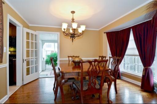 9 West Touhy Avenue Park Ridge, IL 60068 - Photo 3 of 8 a view of a dining room with furniture window and wooden floor