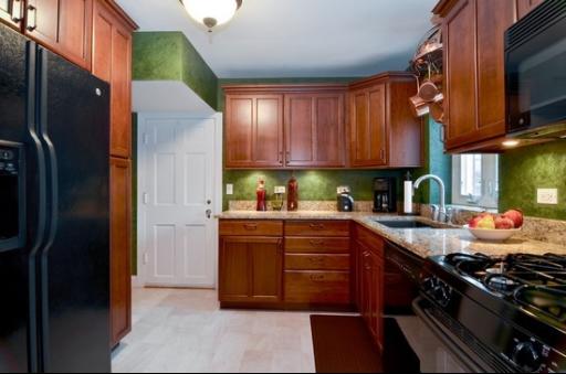 9 West Touhy Avenue Park Ridge, IL 60068 - Photo 4 of 8 a kitchen with stainless steel appliances granite countertop a refrigerator and a stove