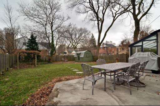 9 West Touhy Avenue Park Ridge, IL 60068 - Photo 8 of 8 a view of a table and chairs in backyard of the house