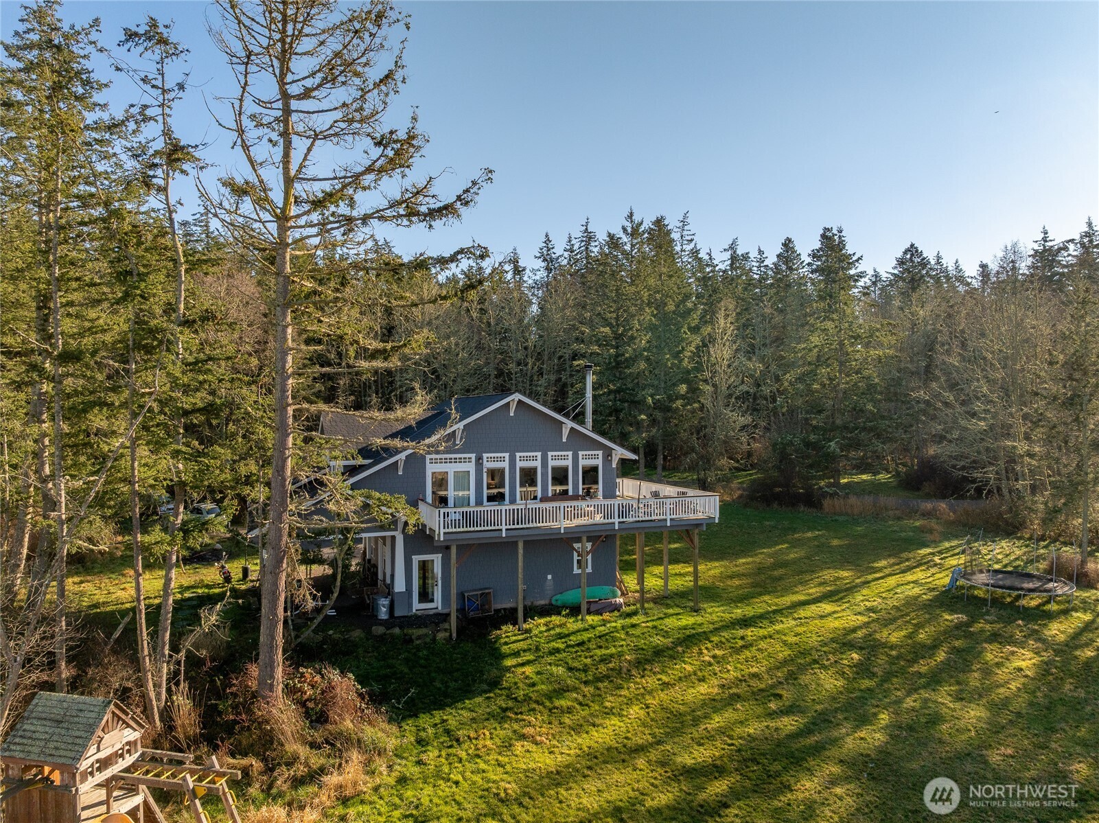 1372 Bakerview Road Lopez Island, WA 98261 - Photo 1 of 22 a view of a house with a yard in front of it