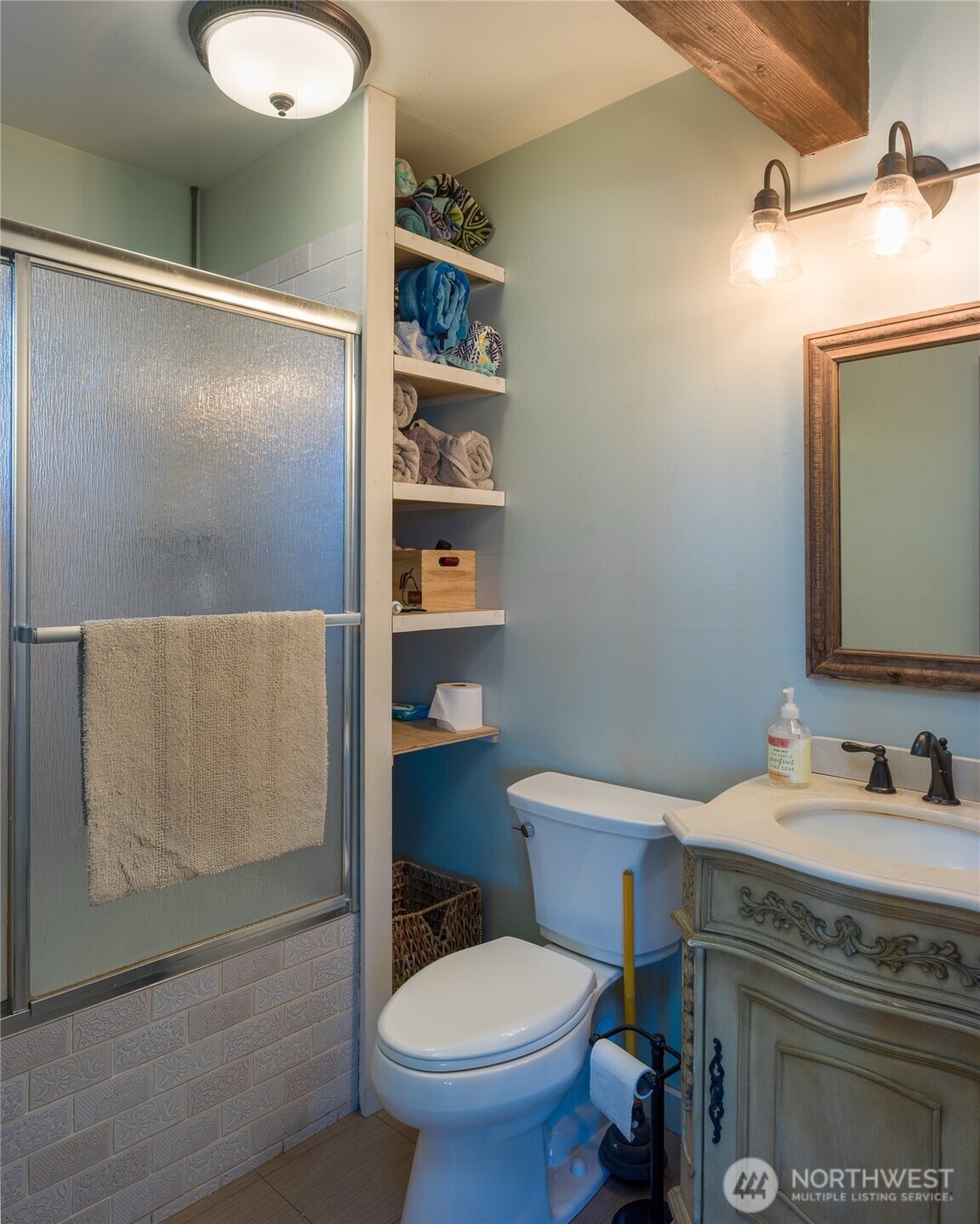 1372 Bakerview Road Lopez Island, WA 98261 - Photo 14 of 22 a bathroom with a granite countertop sink toilet and shower