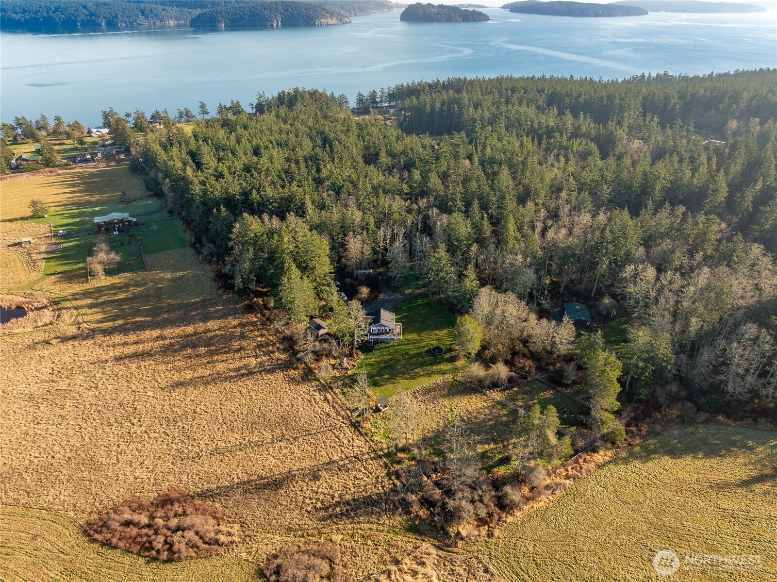 1372 Bakerview Road Lopez Island, WA 98261 - Photo 21 of 22 a view of a yard with wooden fence