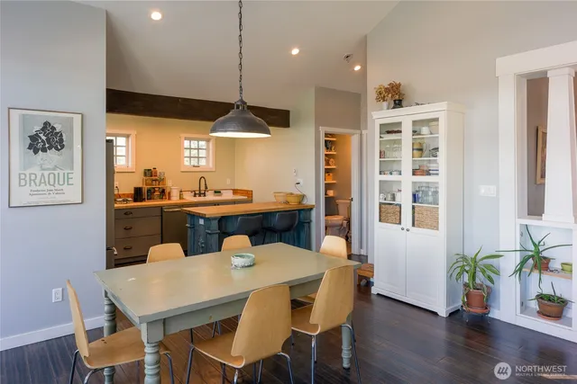 a kitchen with a table and chairs in it
