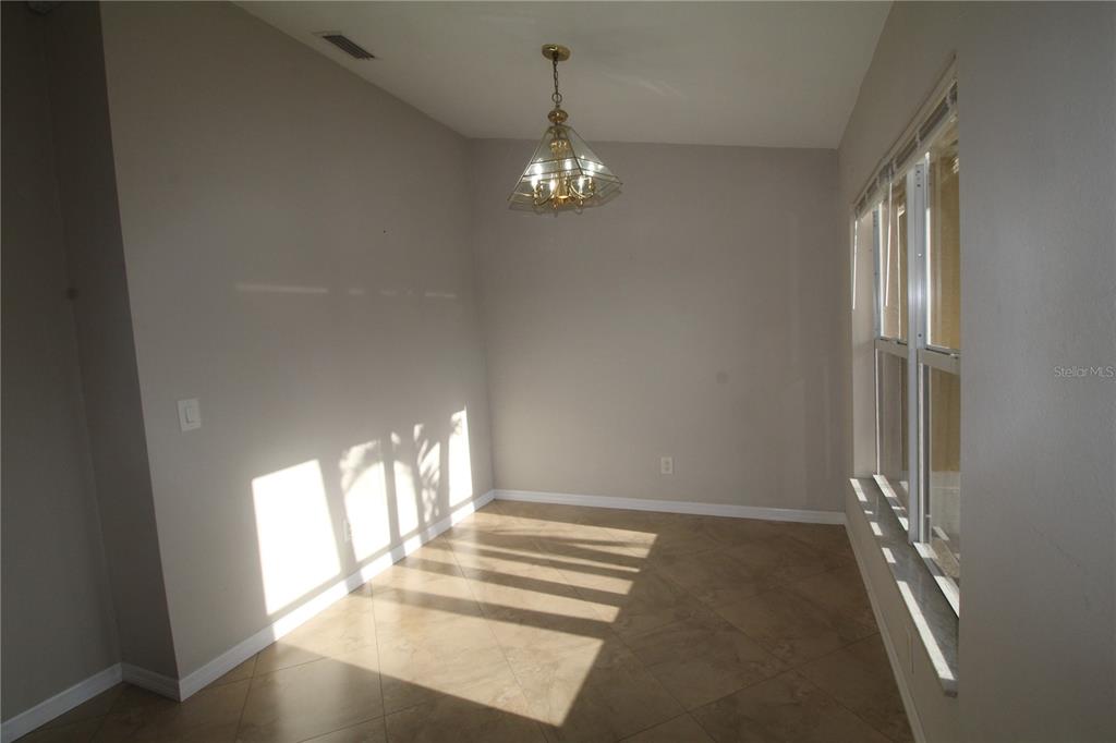 5508 Douglas Road North Port, FL 34288 - Photo 3 of 12 a view of an empty room with a window