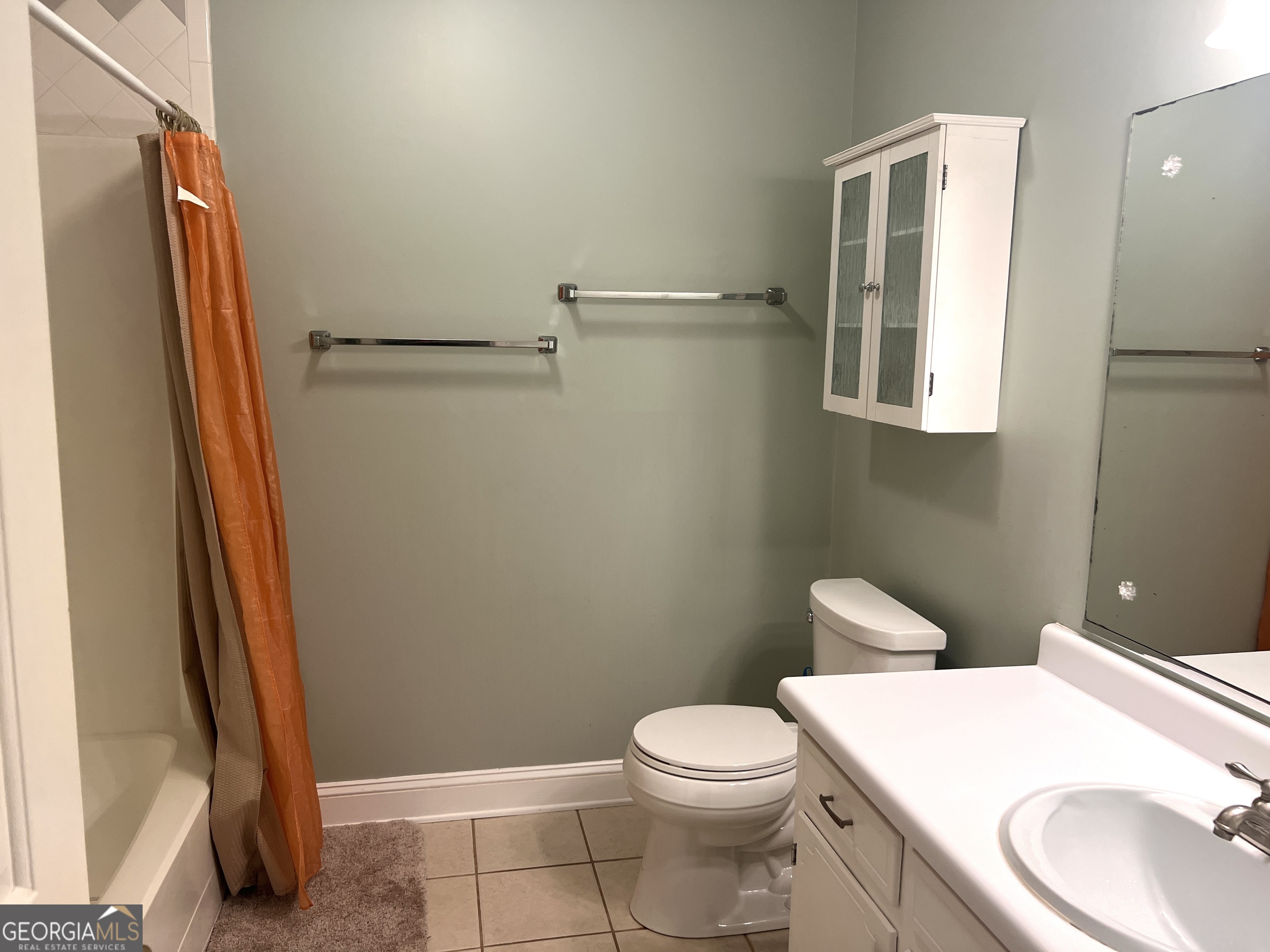345 Caldwell Circle Athens, GA 30605 - Photo 12 of 38 a white toilet sitting next to a bathroom sink and vanity
