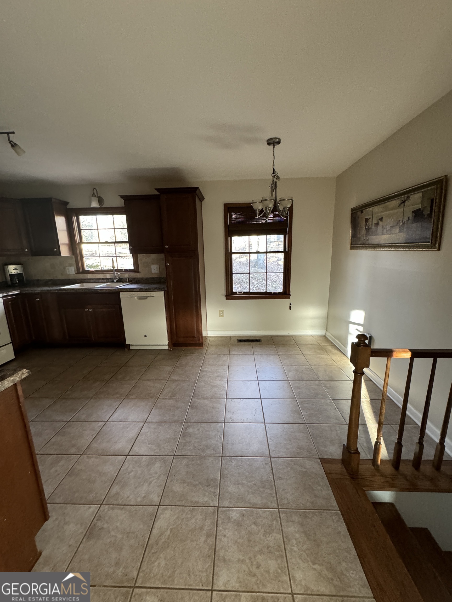 345 Caldwell Circle Athens, GA 30605 - Photo 22 of 38 a kitchen with granite countertop a rug a stove a microwave and a counter top space