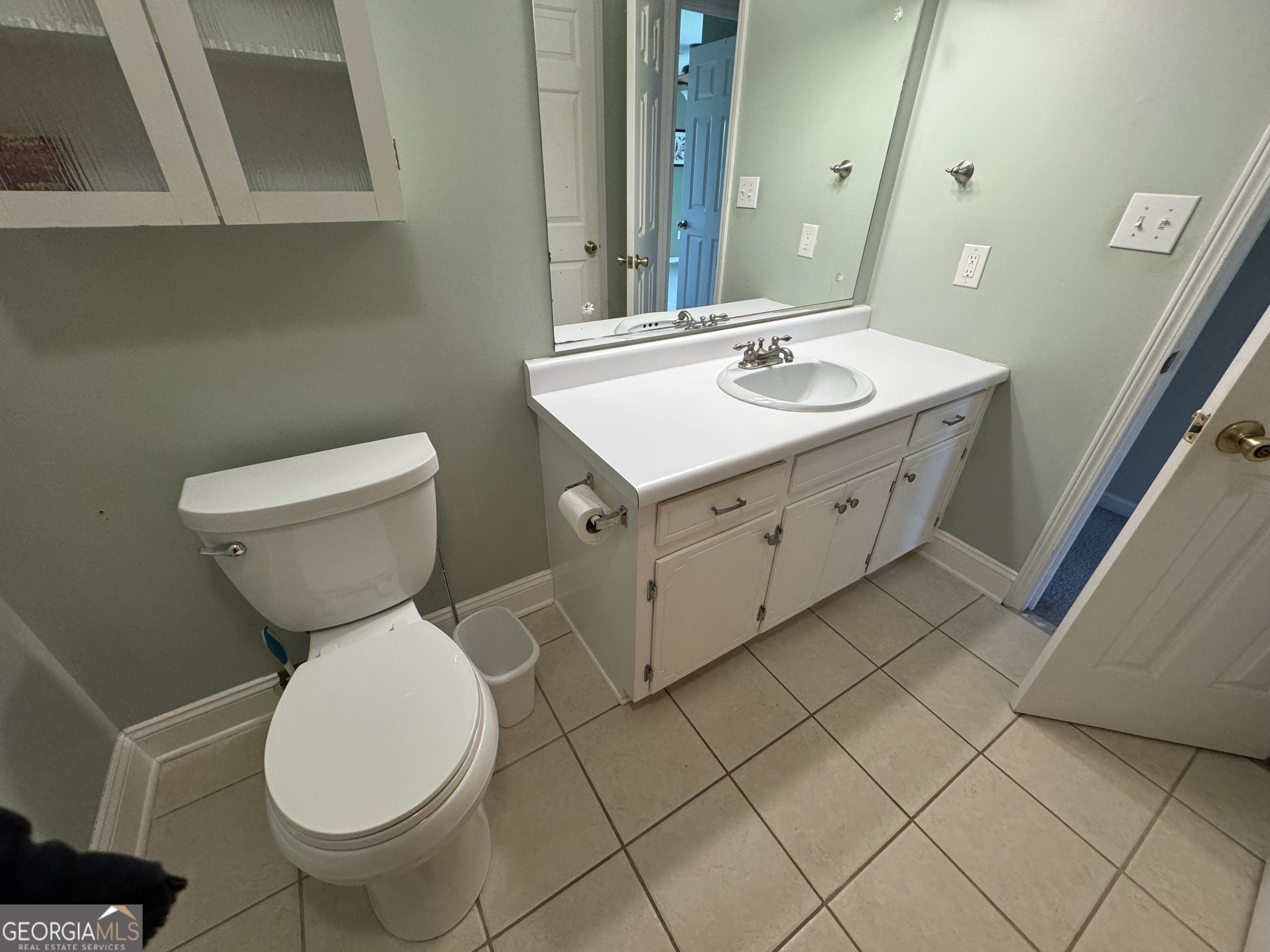 345 Caldwell Circle Athens, GA 30605 - Photo 23 of 38 a bathroom with a toilet sink and mirror