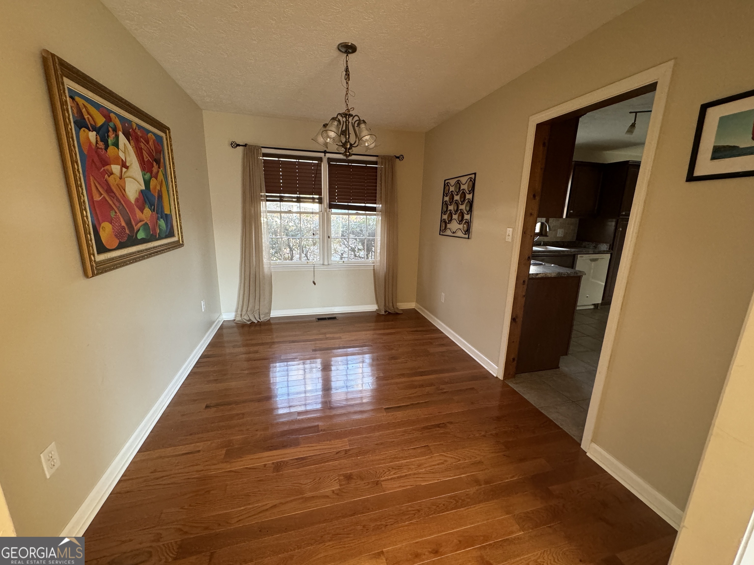345 Caldwell Circle Athens, GA 30605 - Photo 34 of 38 a view of hallway with wooden floor and stairs