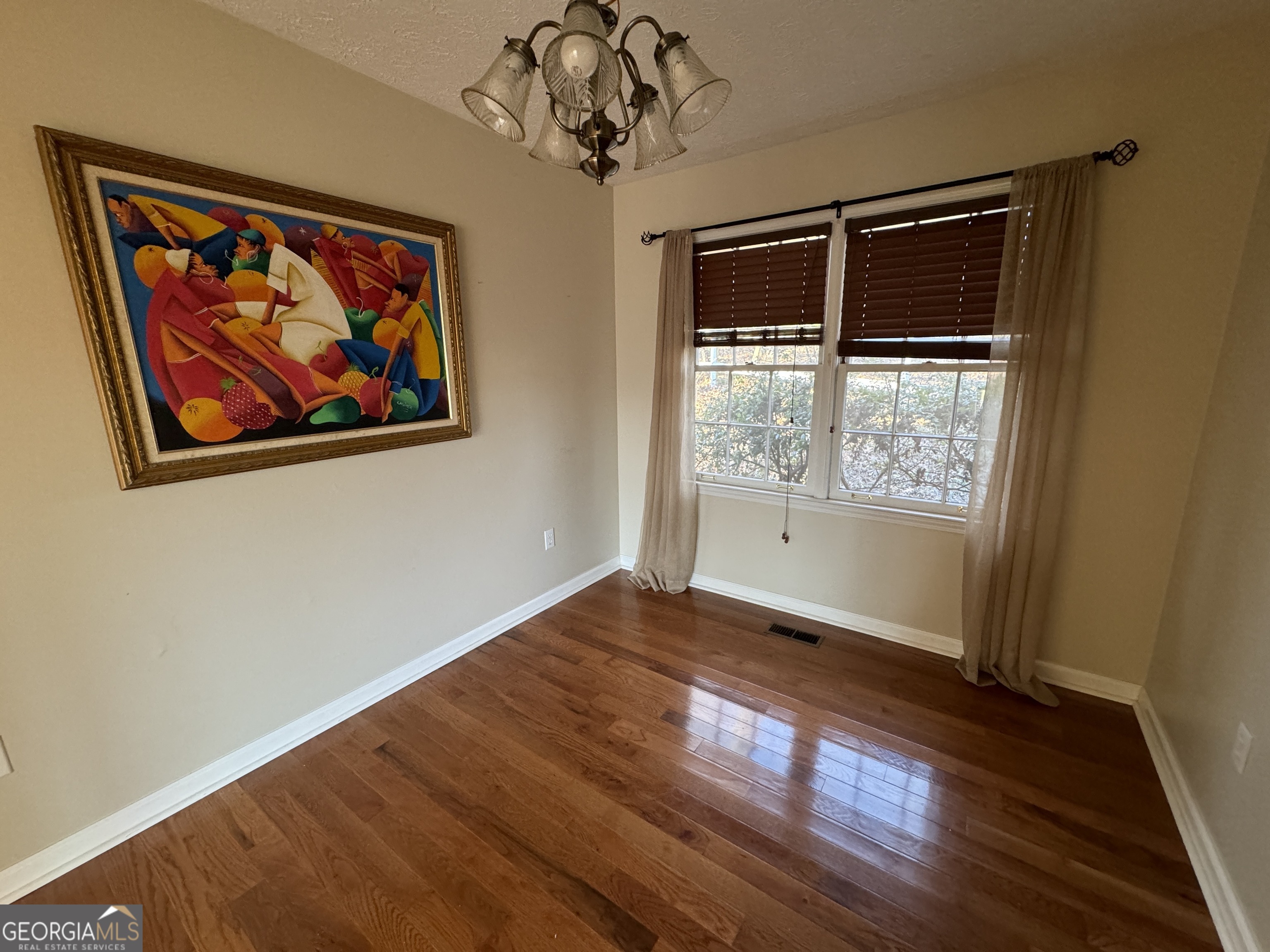 345 Caldwell Circle Athens, GA 30605 - Photo 35 of 38 a view of an empty room with a window and wooden floor