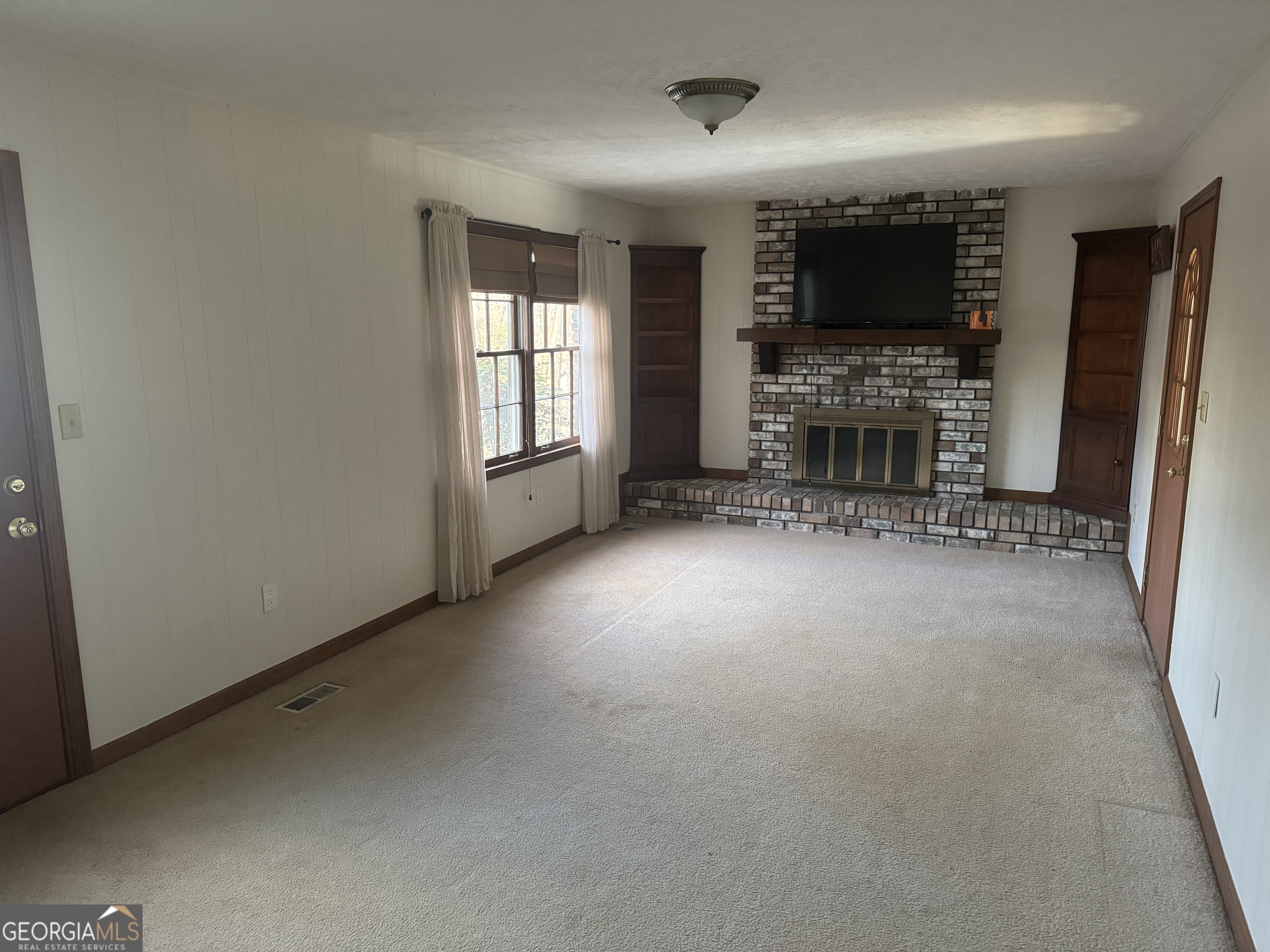 345 Caldwell Circle Athens, GA 30605 - Photo 36 of 38 an empty room with fireplace and a window