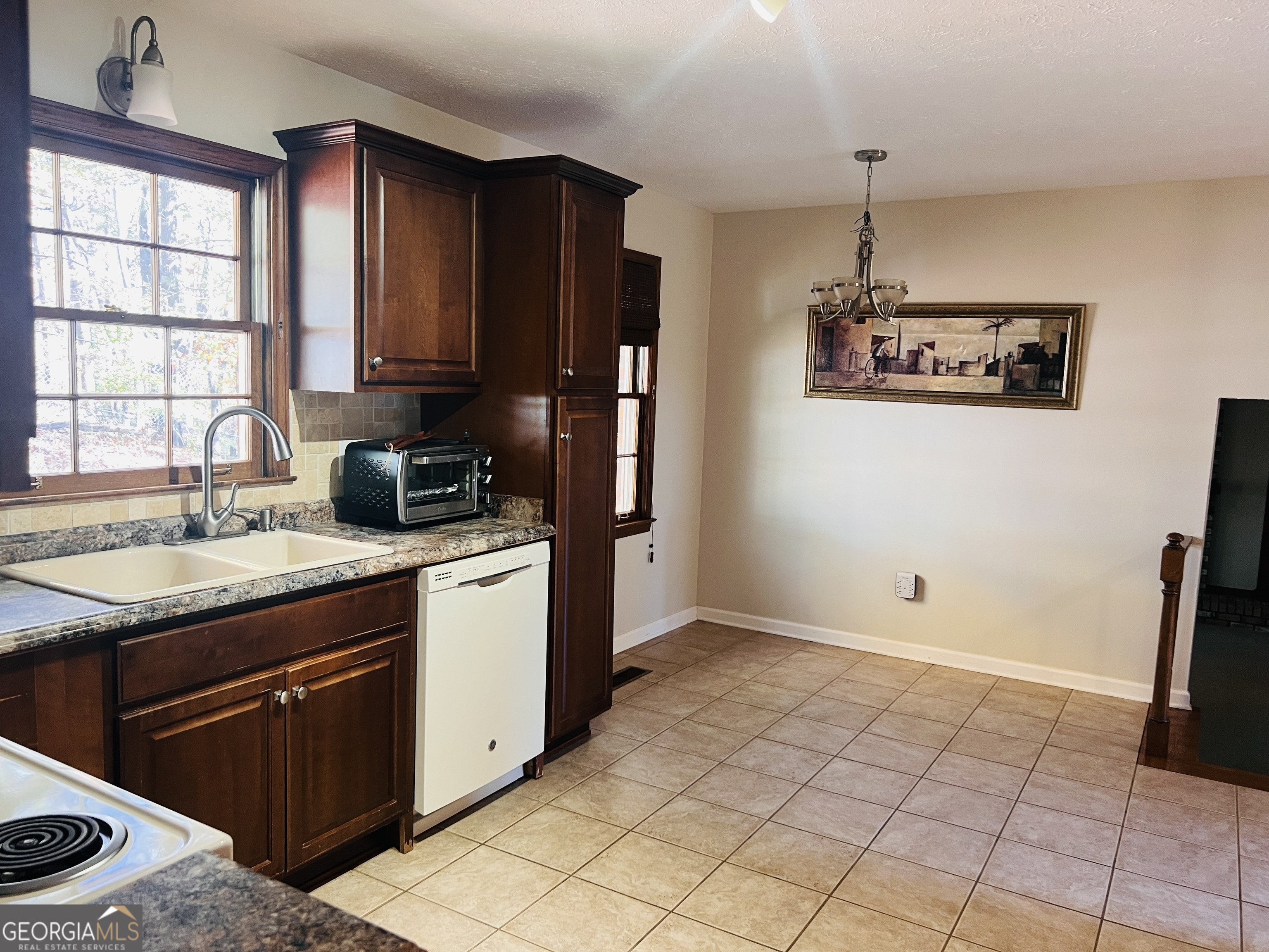 345 Caldwell Circle Athens, GA 30605 - Photo 7 of 38 a kitchen with a sink cabinets and window