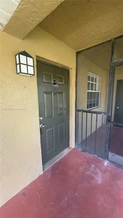 a kitchen with a sink a stove and a refrigerator