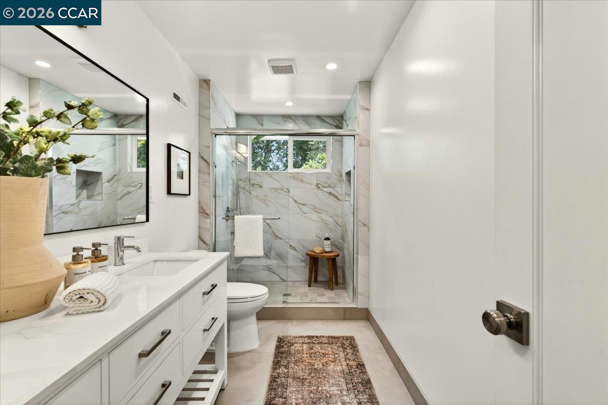 24 Las Vegas Road Orinda, CA 94563 - Photo 24 of 47 a bathroom with a sink a toilet and mirror