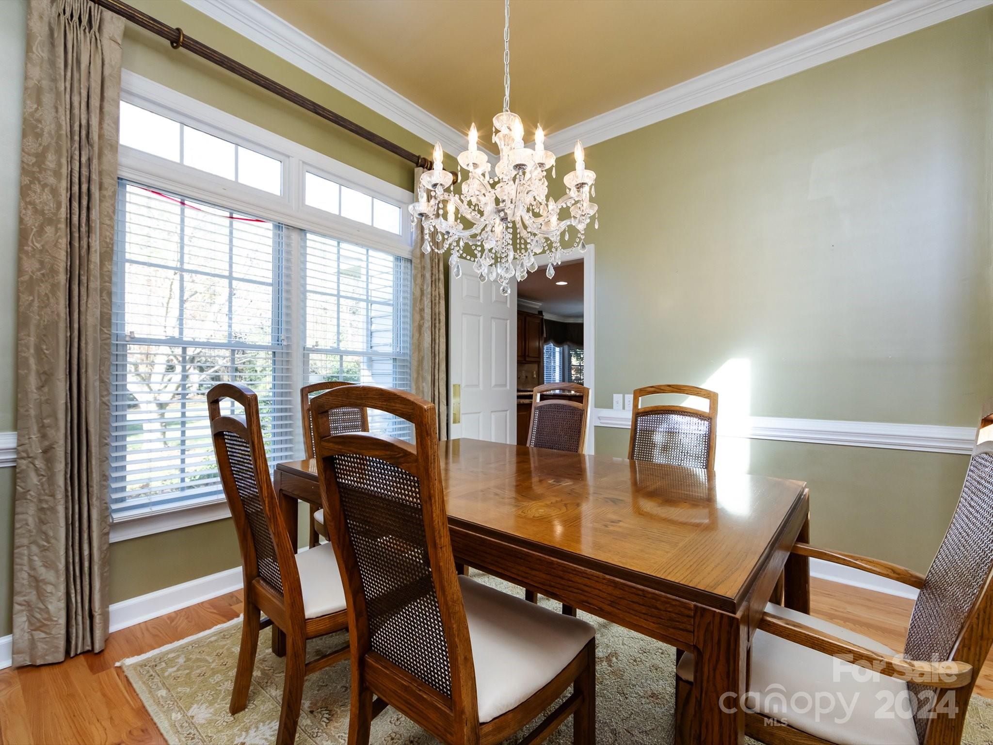 3534 Nestling Lane Fort Mill, SC 29708 - Photo 11 of 44 a dining room with furniture and chandelier
